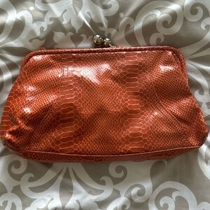 Orange clutch with silver snap
